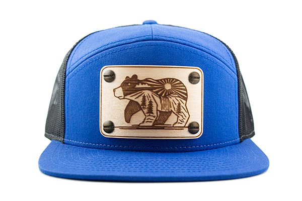 Blue 7-panel cap with maple wood patch.