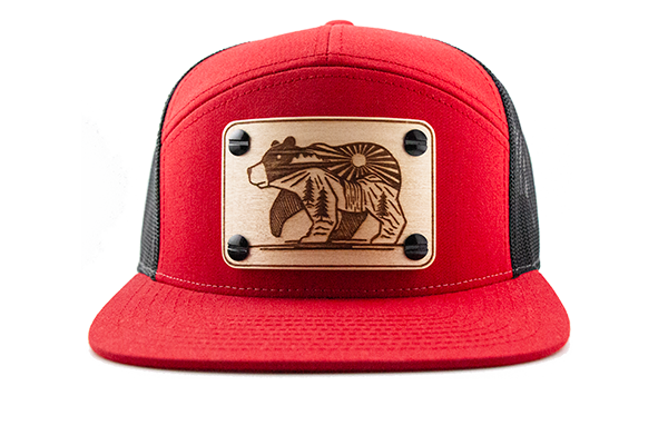 Red 7-panel cap with maple wood patch.