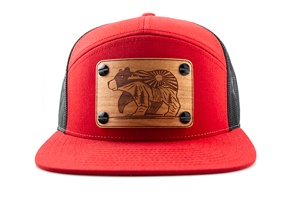 Red 7-panel cap with cherry wood patch.