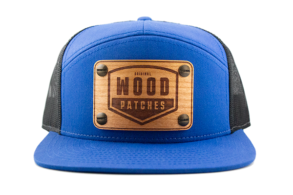 Blue 7-panel cap with cherry wood patch.