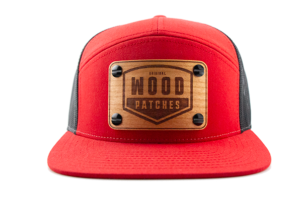 Red 7-panel cap with cherry wood patch.