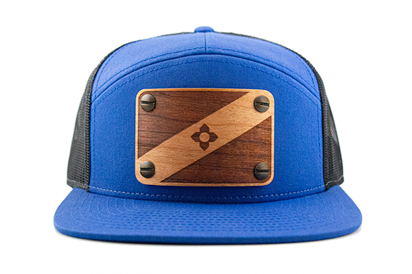 Blue 7-panel cap with cherry wood patch.