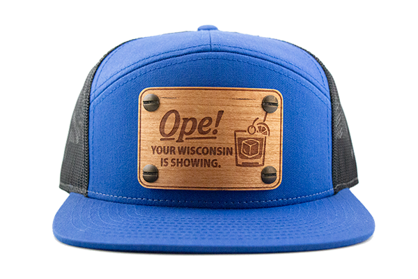 Blue 7-panel cap with cherry wood patch.